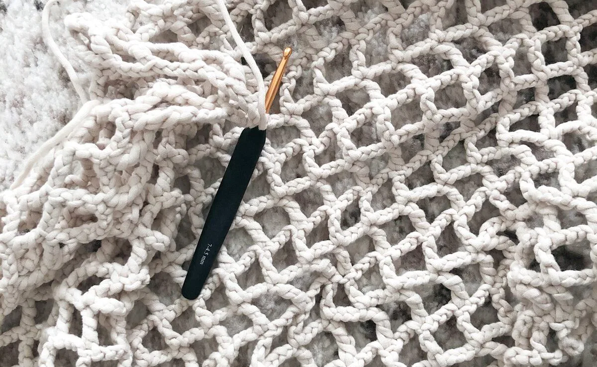 blue and yellow plastic tool on white textile