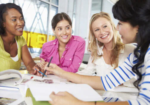 Group Of Women Meeting In Creative Office