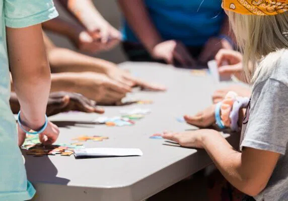 people playing cards on table